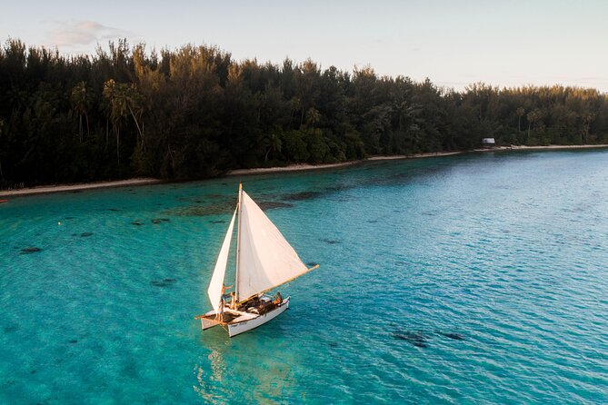 Sunset with a homemade traditional sailing canoe